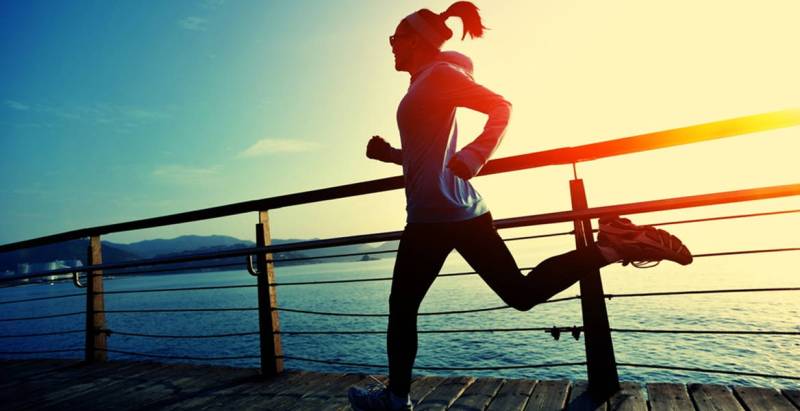 A girl is running to reduce belly fat