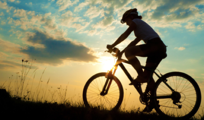 A man riding a bike,this is a sport method