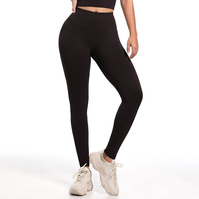 Front view of model's legs wearing black seamless high waist leggings