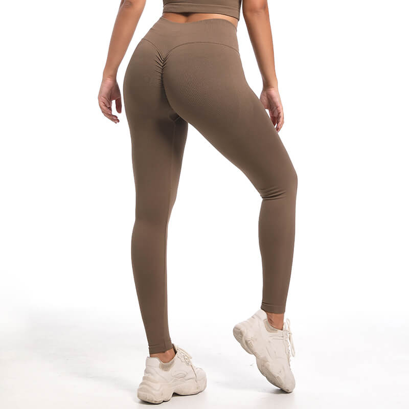 Back view of model's legs wearing brown seamless high waist leggings