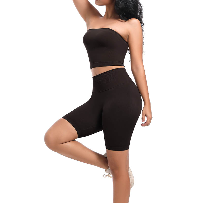 Side view of model's legs wearing black seamless high waist shorts