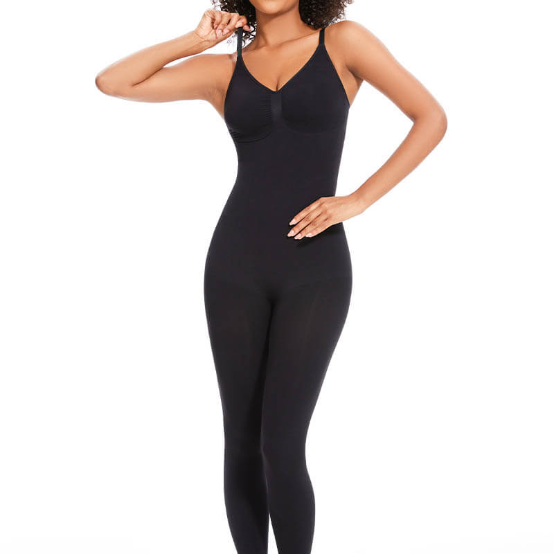 Front view of a model wearing a black seamless yoga jumpsuit